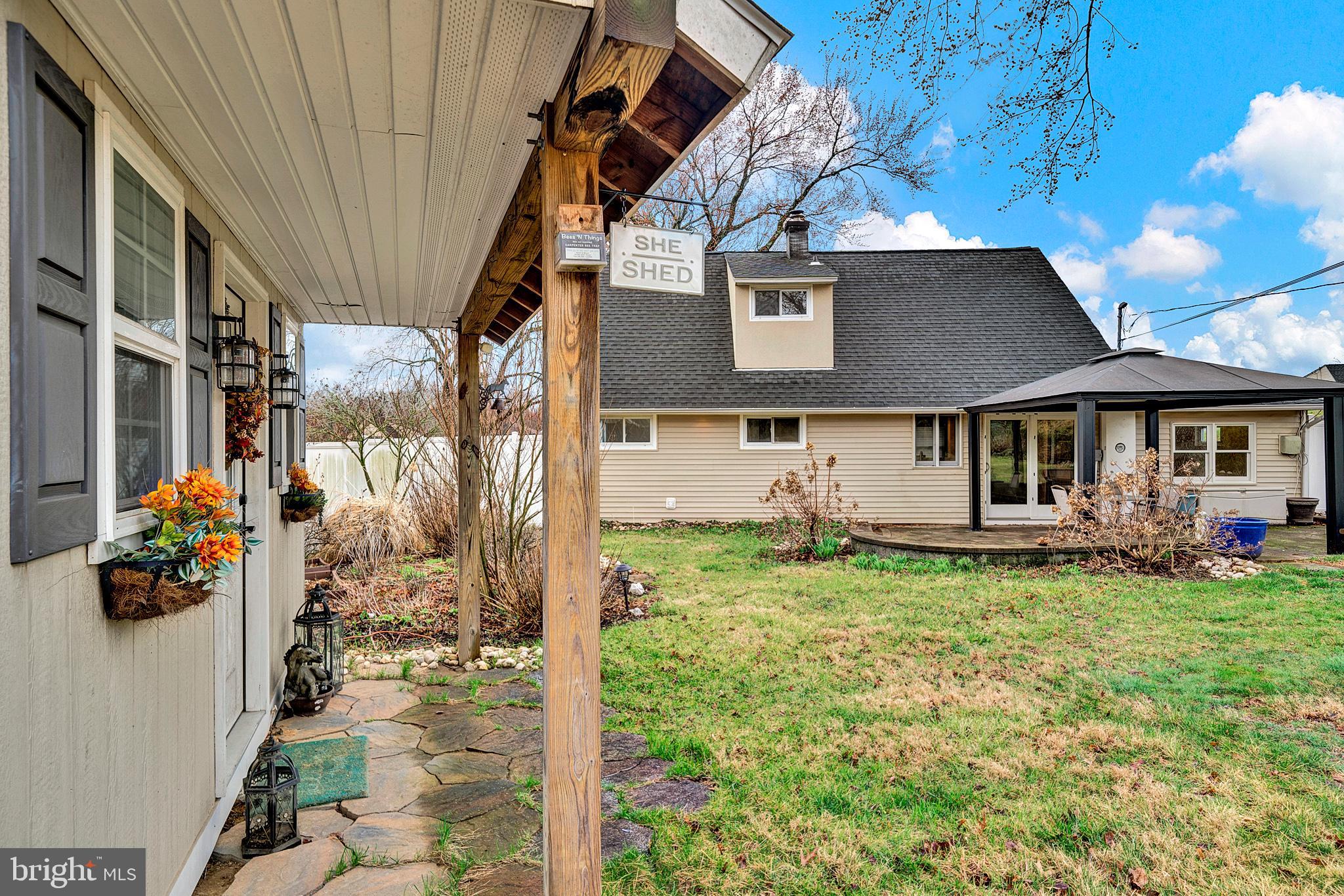 6 Unity Turn Levittown, PA 19056 - Photo 38 of 50 a view of a house with a chairs in a patio