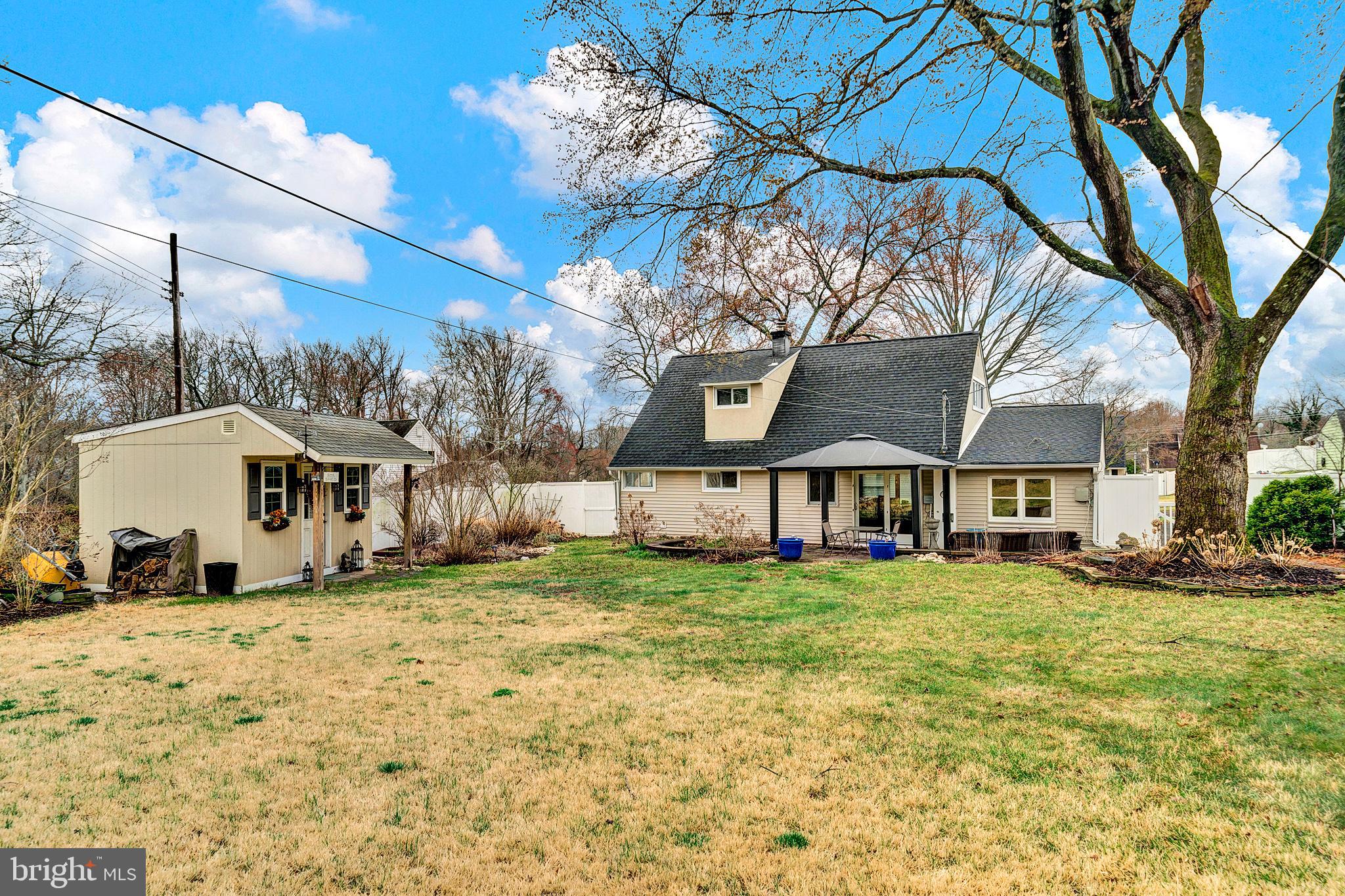 6 Unity Turn Levittown, PA 19056 - Photo 42 of 50 a large house with a large tree in front of it