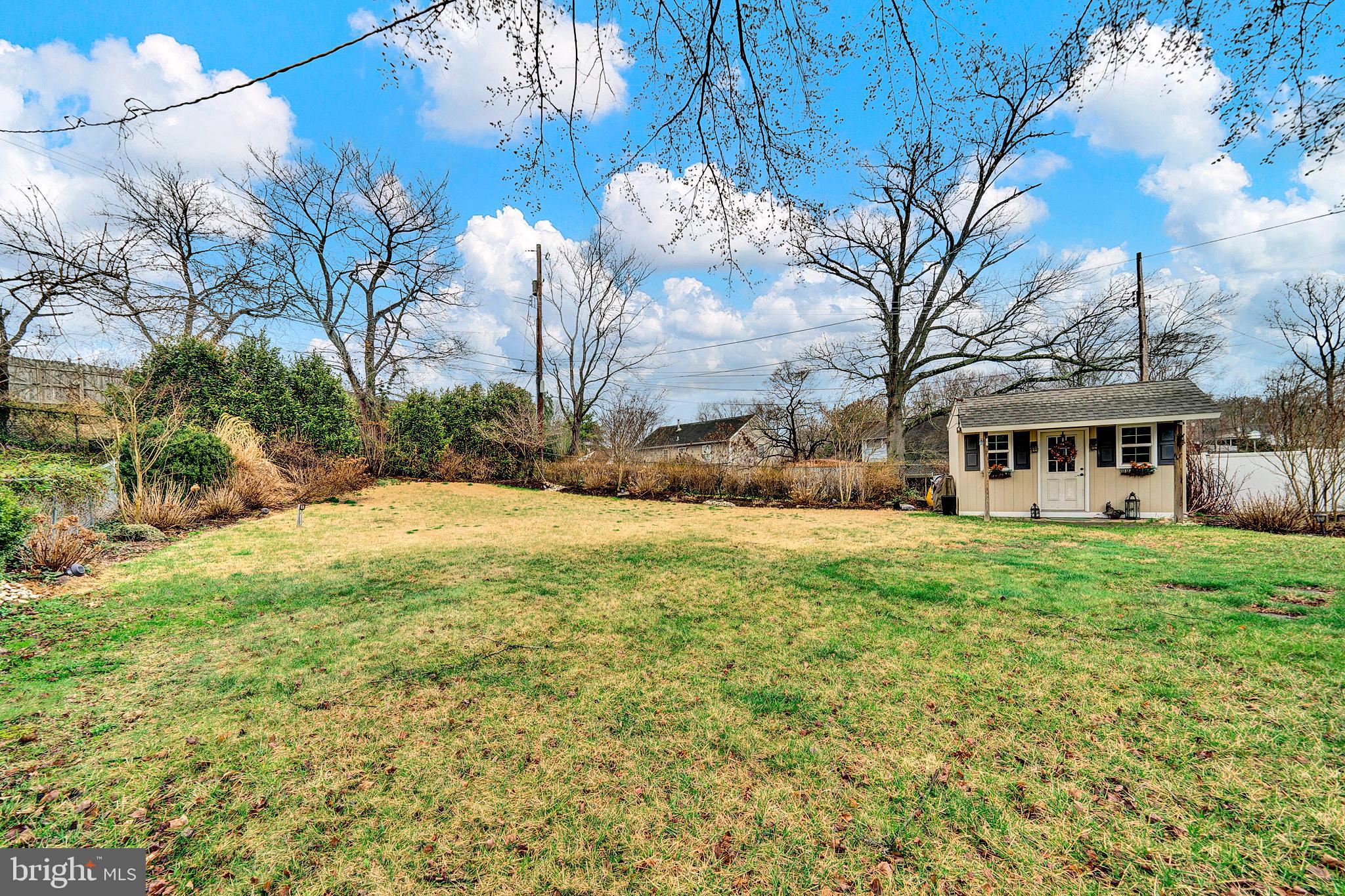 6 Unity Turn Levittown, PA 19056 - Photo 46 of 50 a front view of a house with yard and green space