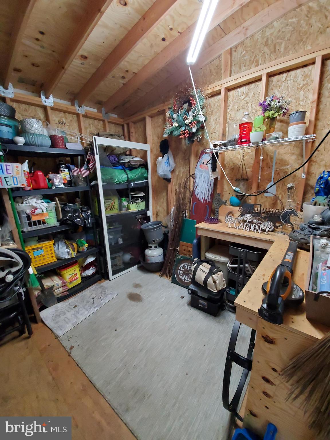 6 Unity Turn Levittown, PA 19056 - Photo 49 of 50 a view of a garage with a bike and a garage