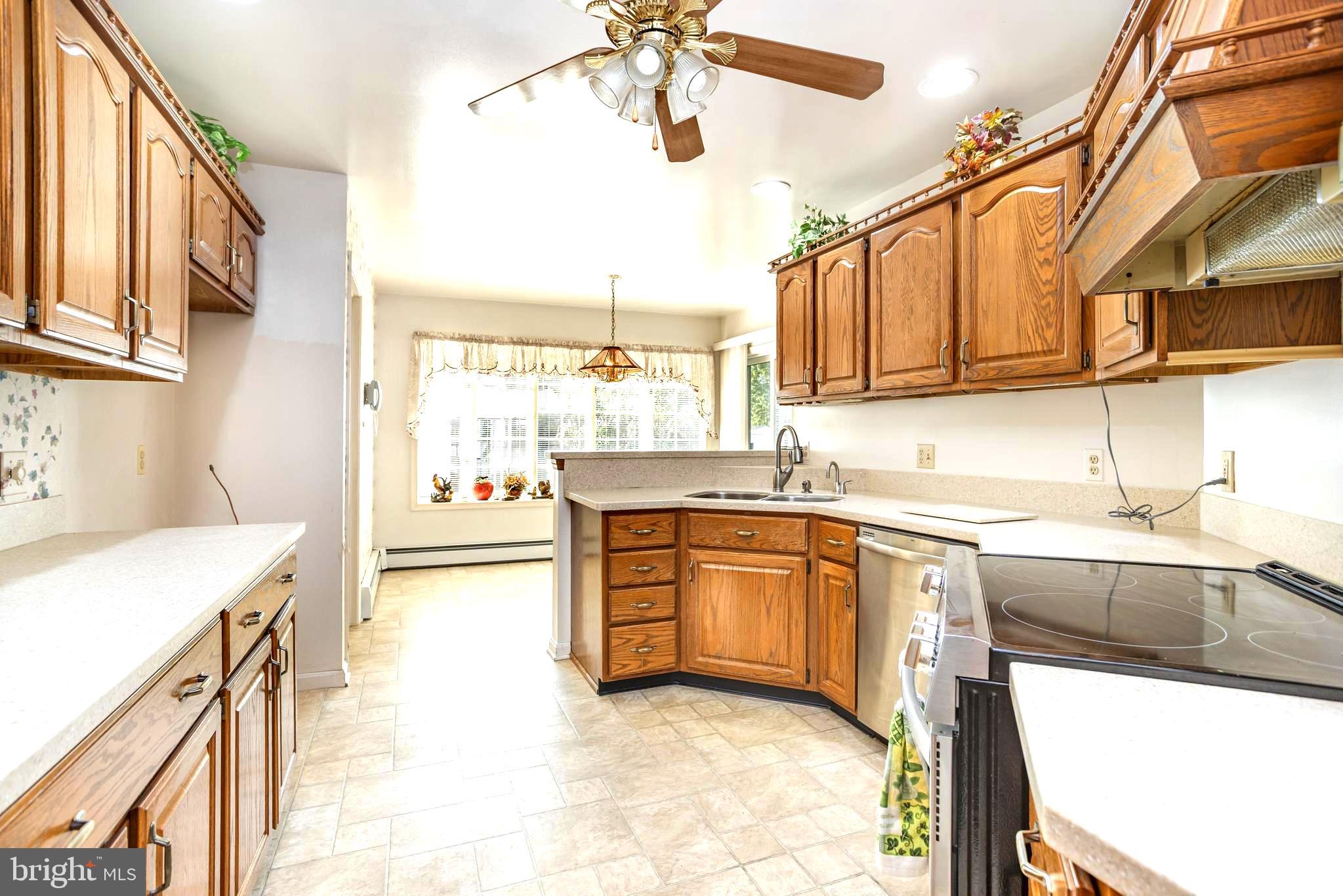 7252 Meadow Lane Baltimore, MD 21222 - Photo 11 of 80 a kitchen with stainless steel appliances granite countertop a sink and stove