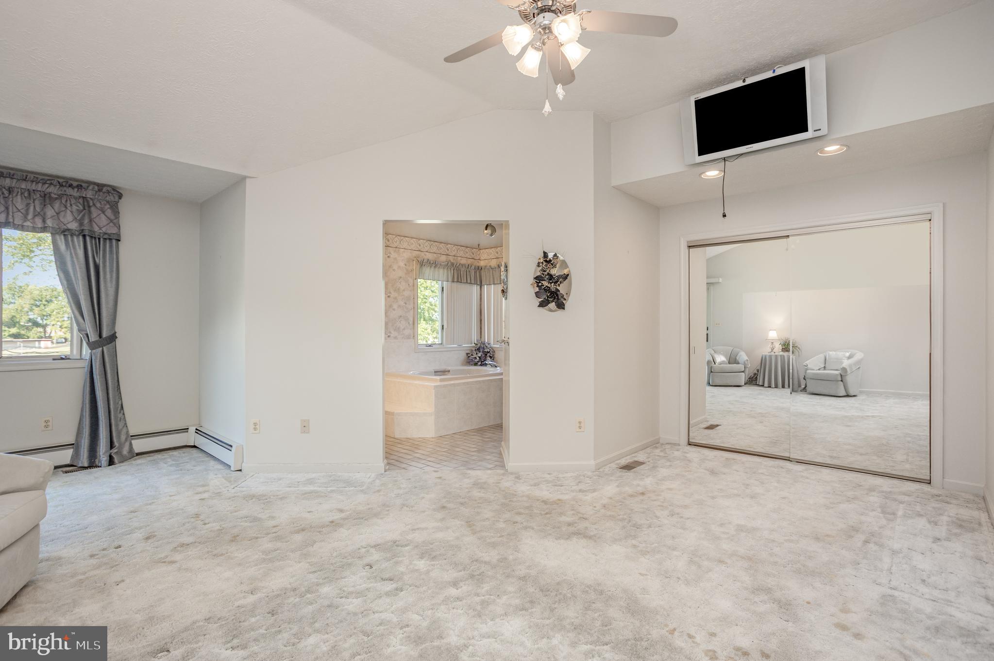 7252 Meadow Lane Baltimore, MD 21222 - Photo 20 of 80 an empty room with fan and windows