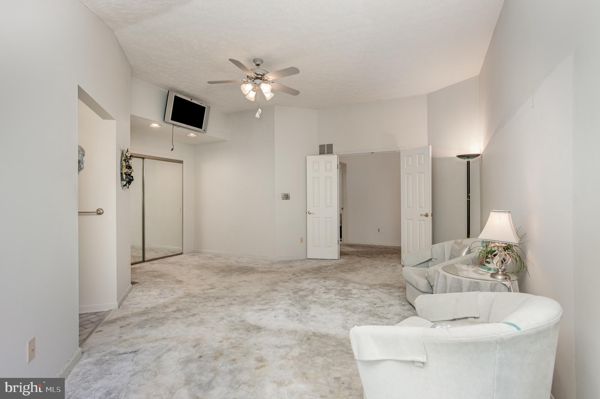 7252 Meadow Lane Baltimore, MD 21222 - Photo 21 of 80 a living room with furniture and a chandelier