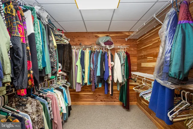 a bathroom with a sink mirror and a shower
