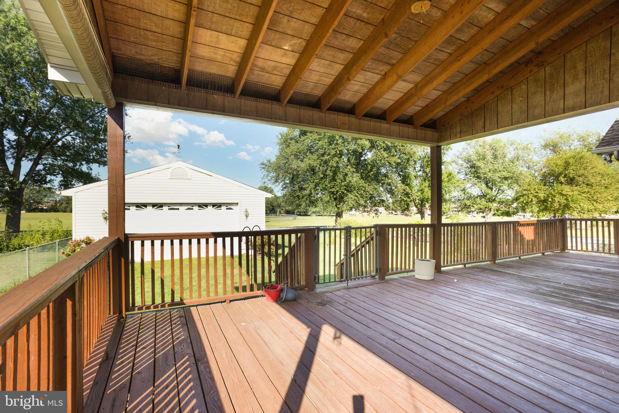 7252 Meadow Lane Baltimore, MD 21222 - Photo 33 of 80 a balcony with wooden floor