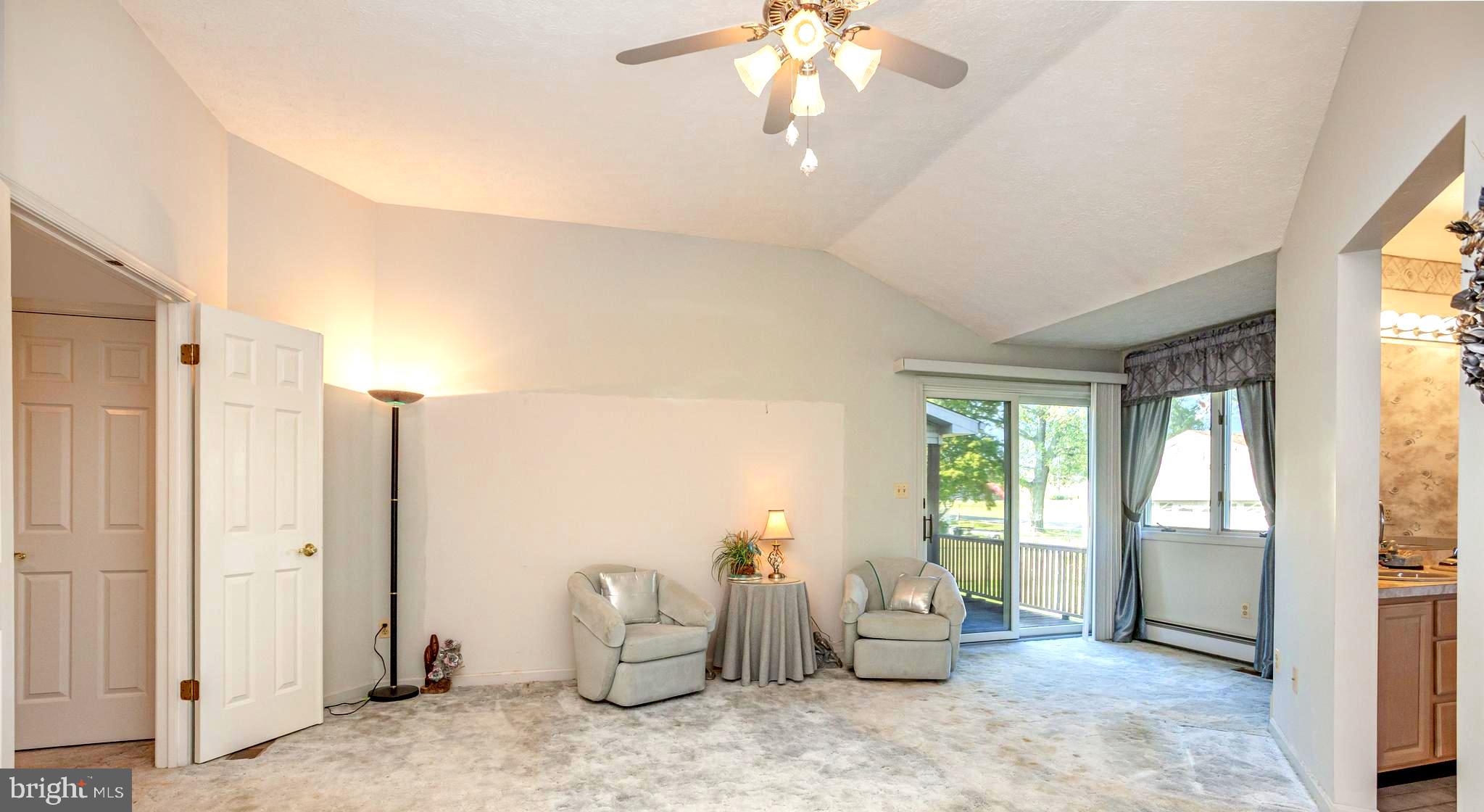 7252 Meadow Lane Baltimore, MD 21222 - Photo 4 of 80 a living room with furniture and a chandelier