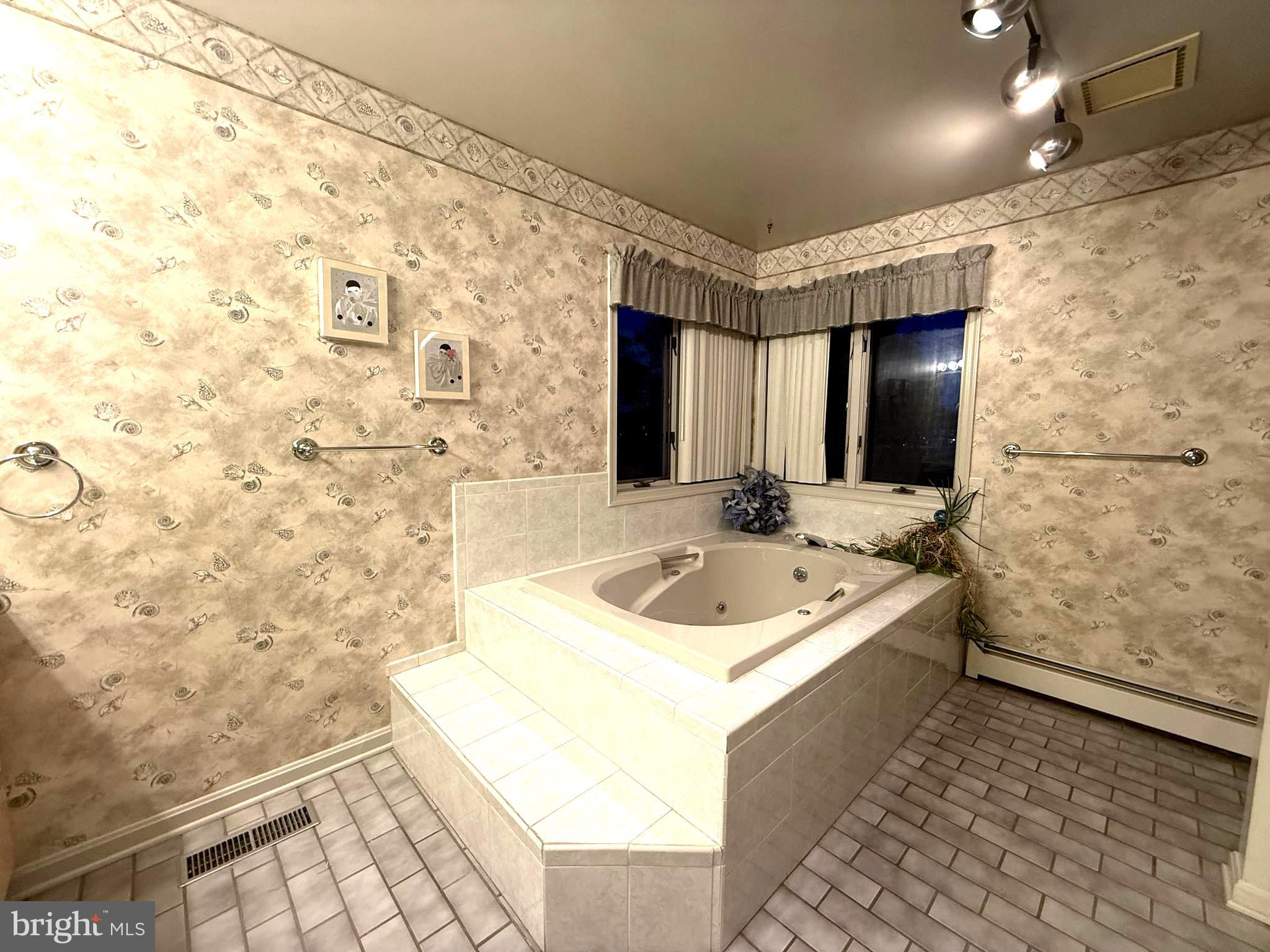 7252 Meadow Lane Baltimore, MD 21222 - Photo 45 of 80 a bathroom with a sink a toilet and mirror