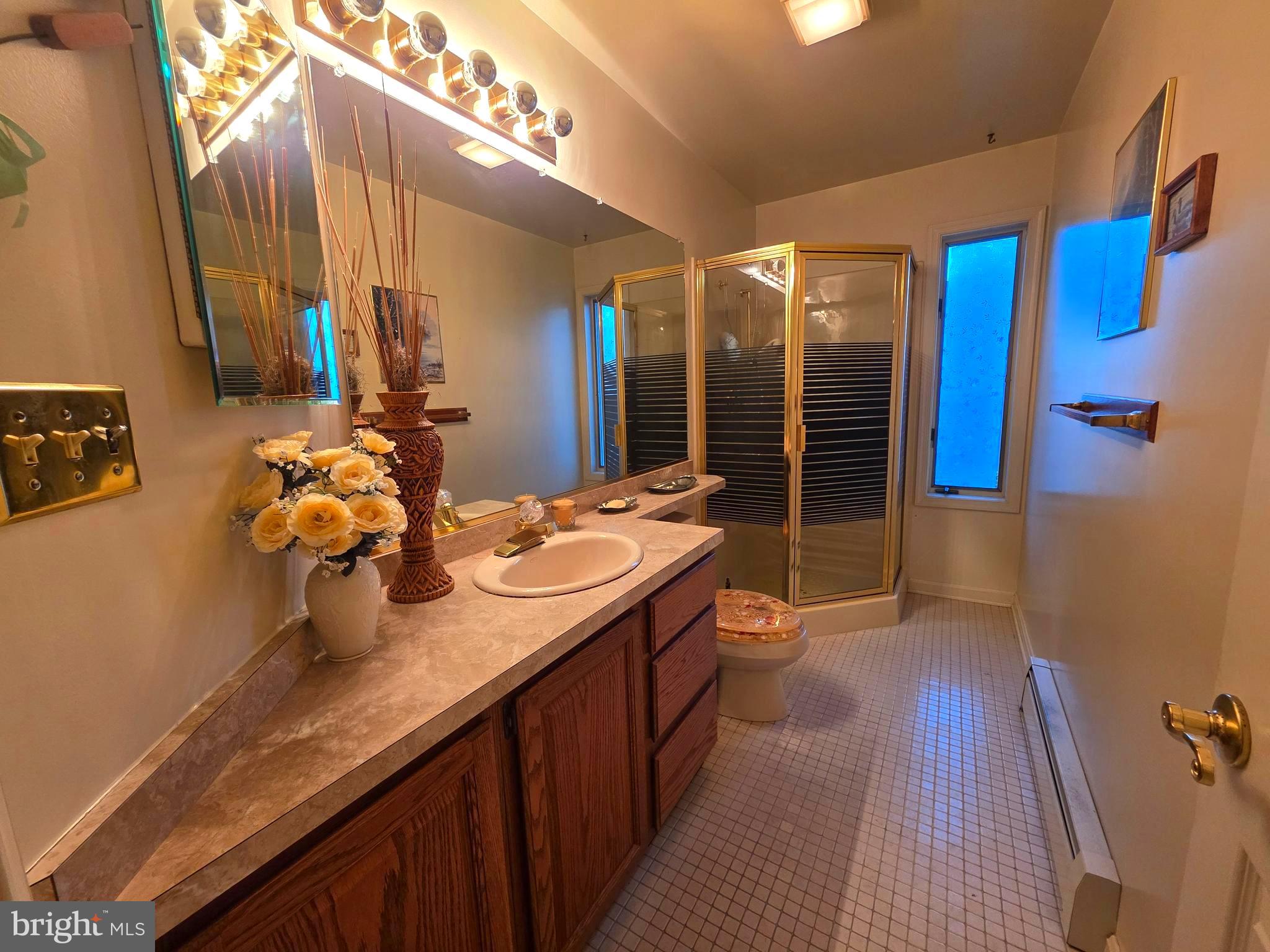 7252 Meadow Lane Baltimore, MD 21222 - Photo 49 of 80 a bathroom with a double vanity sink and a mirror