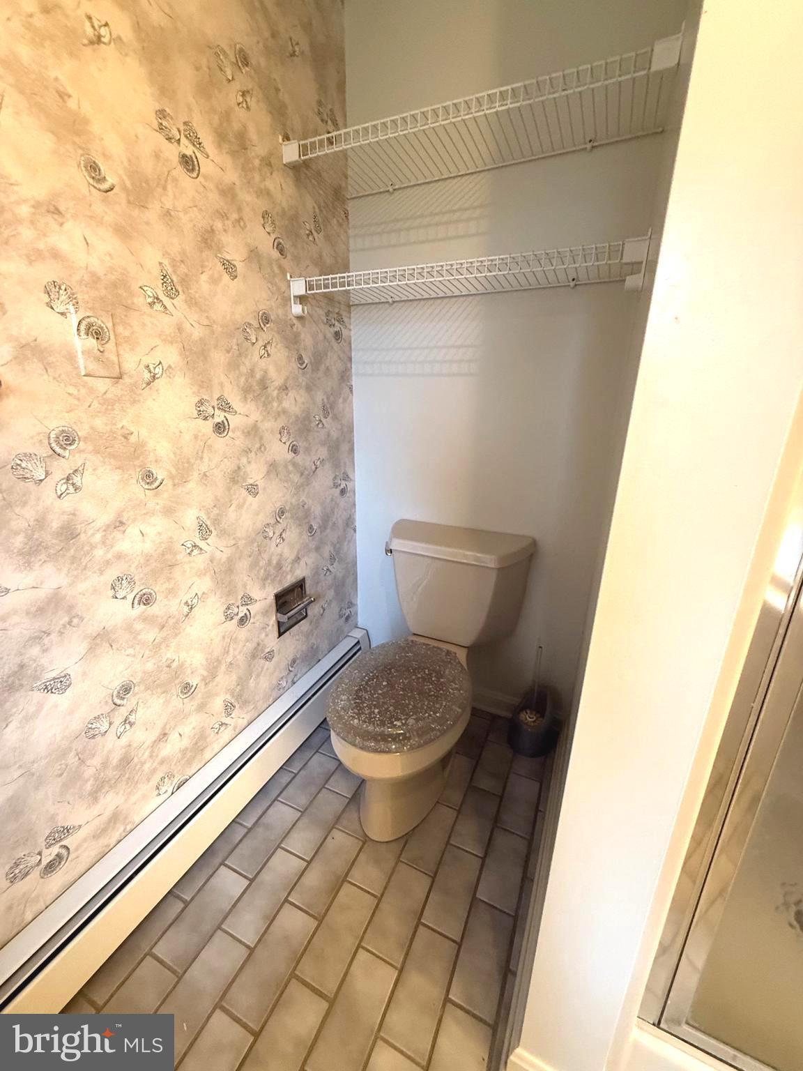 7252 Meadow Lane Baltimore, MD 21222 - Photo 76 of 80 a bathroom with a toilet and a shower
