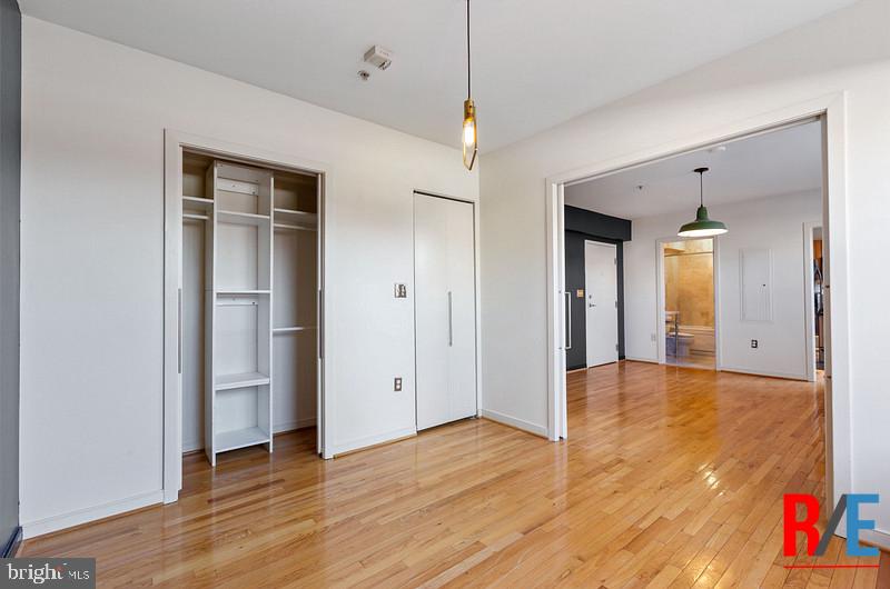 815 King Street, Unit 4E Alexandria, VA 22314 - Photo 13 of 27 a view of empty room with wooden floor and fan
