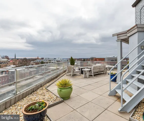 a view of a terrace with chairs
