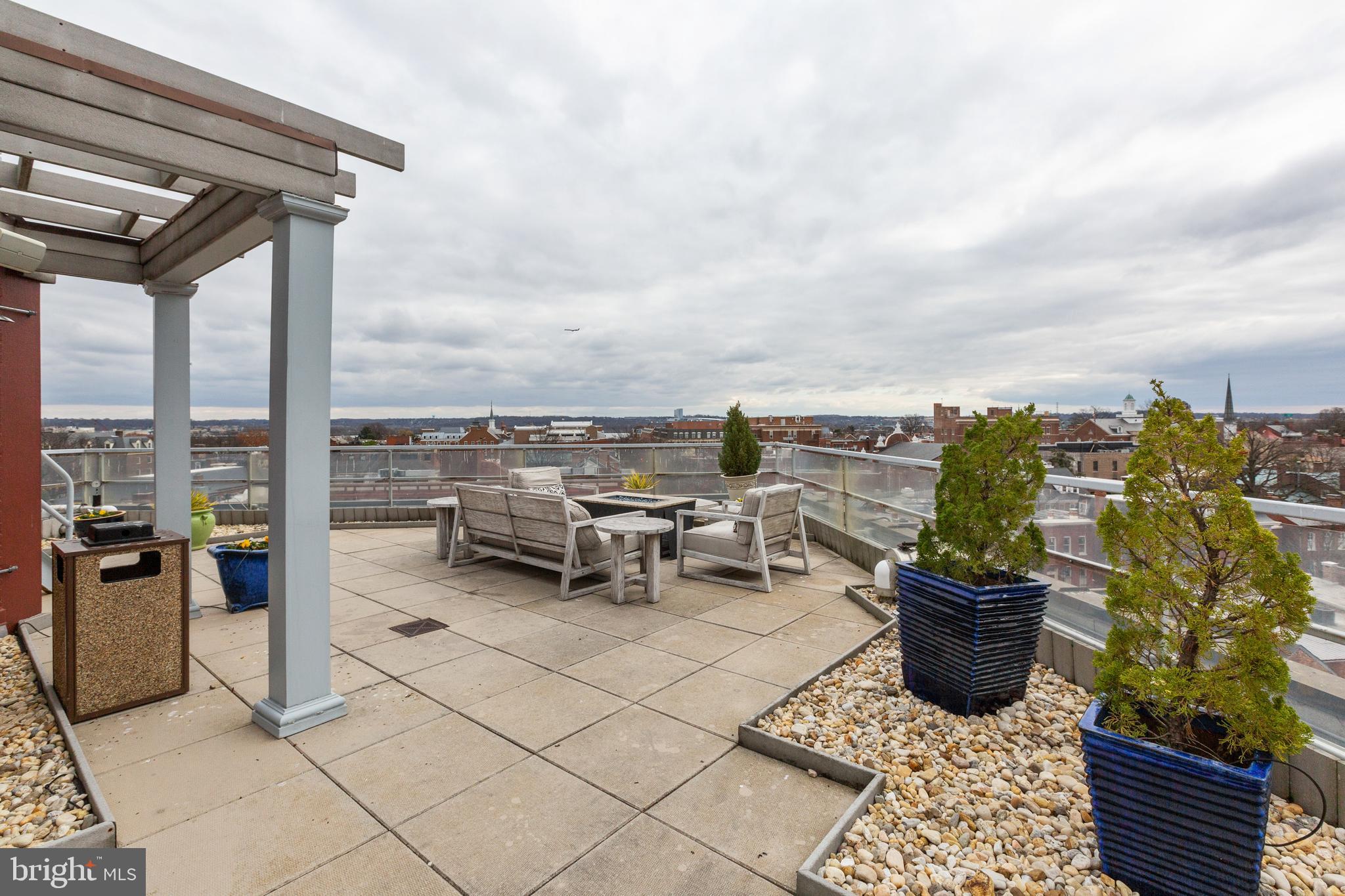 815 King Street, Unit 4E Alexandria, VA 22314 - Photo 19 of 27 a view of a terrace with furniture and city view