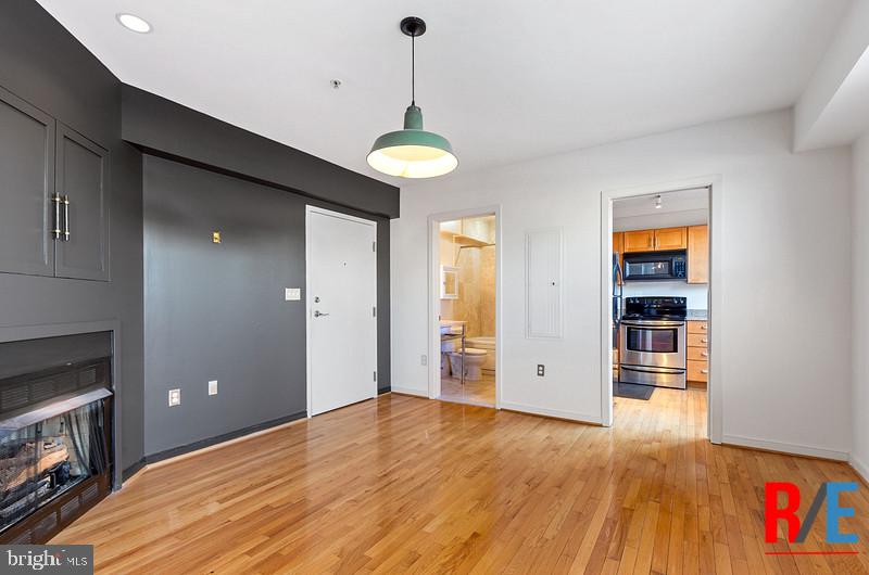 815 King Street, Unit 4E Alexandria, VA 22314 - Photo 6 of 27 a view of empty room with wooden floor and fan