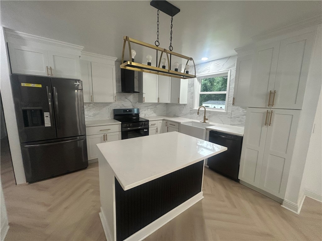 809 Paige Road Honea Path, SC 29654 - Photo 8 of 27 Gleaming counters and modern appliances adorn this kitchen with a stylish island.