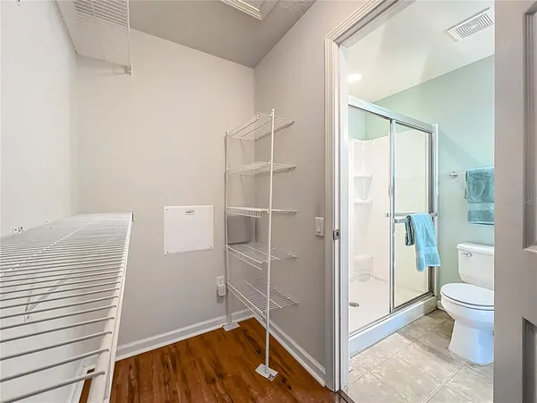 a view of a bathroom with a tub and shower