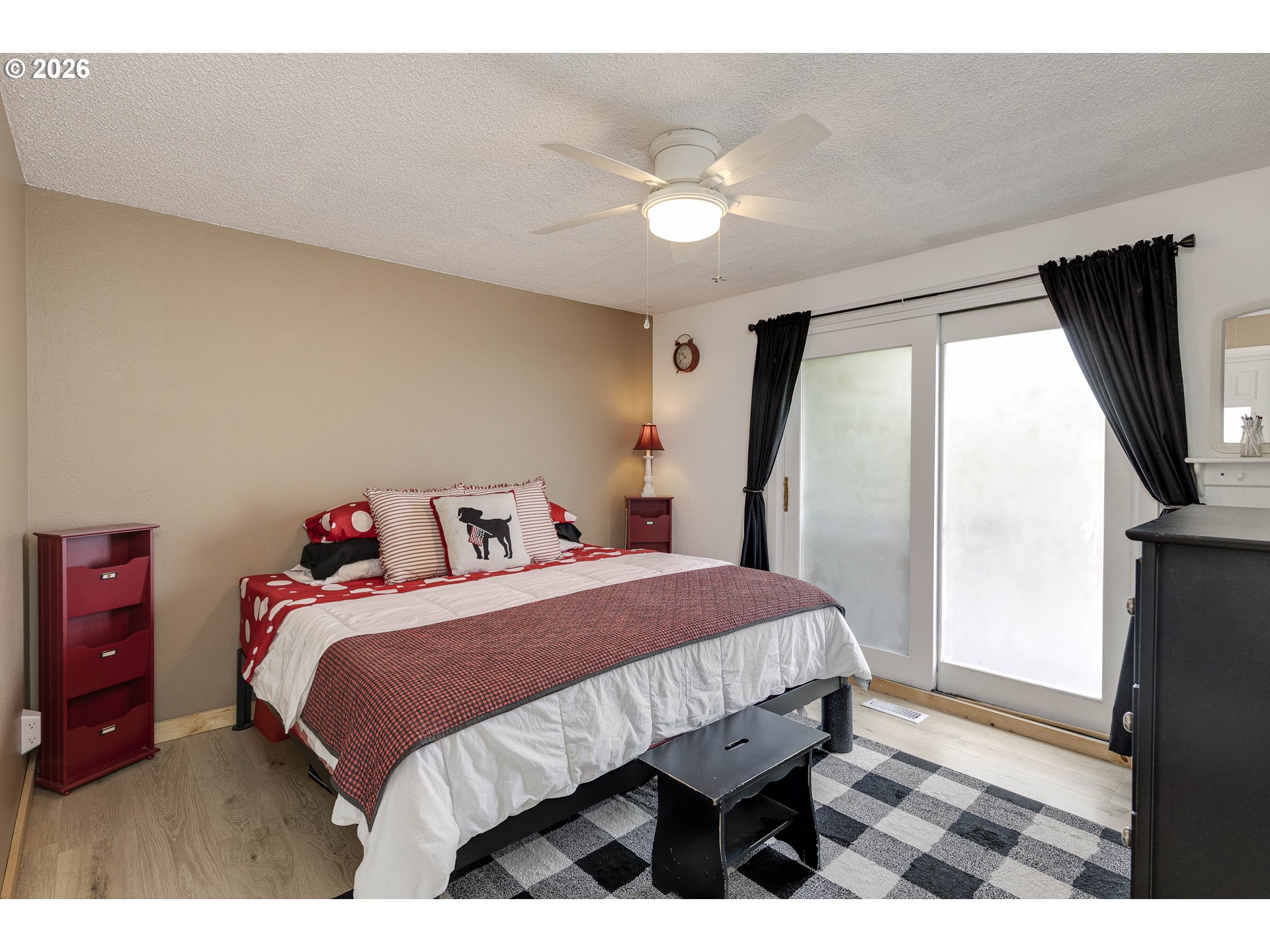 18430 Southwest Broad Oak Boulevard Aloha, OR 97007 - Photo 11 of 32 a bedroom with a bed and a flat screen tv