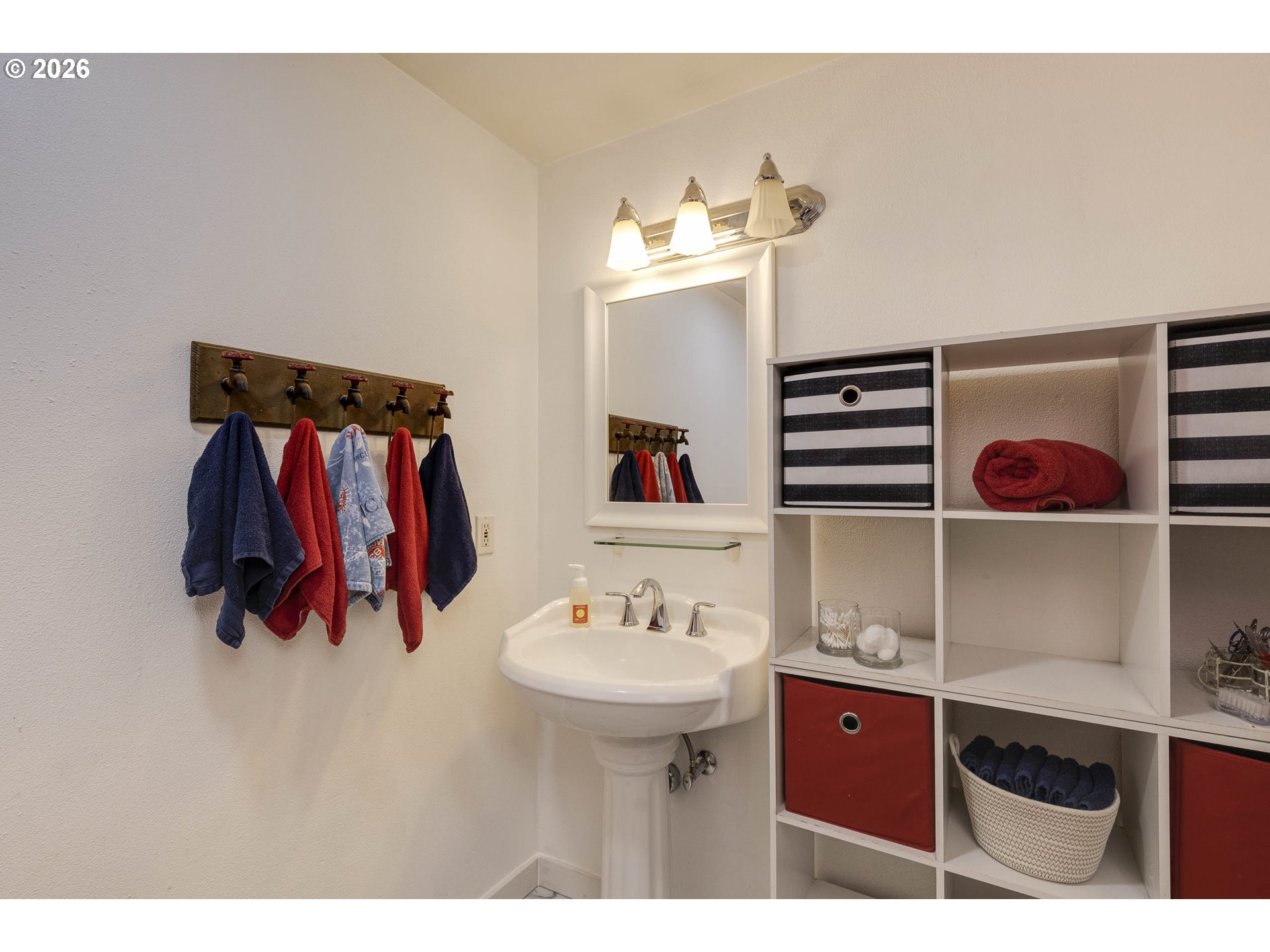 18430 Southwest Broad Oak Boulevard Aloha, OR 97007 - Photo 16 of 32 a bathroom with a sink and a mirror