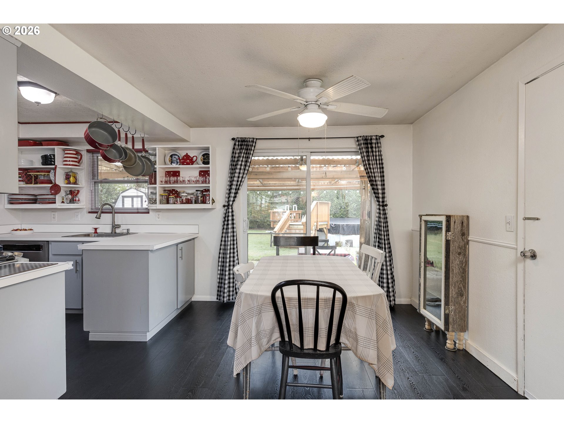 18430 Southwest Broad Oak Boulevard Aloha, OR 97007 - Photo 18 of 32 a dining room with furniture a chandelier and wooden floor