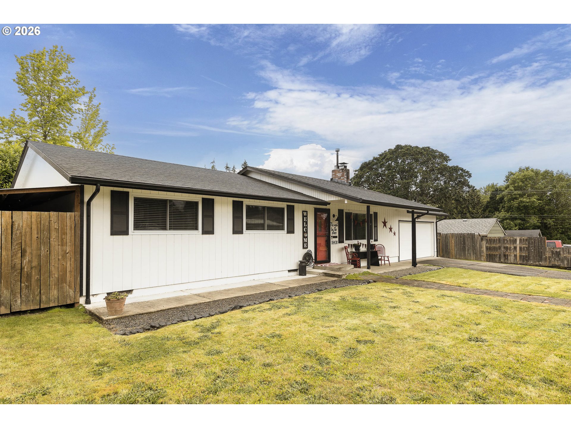 18430 Southwest Broad Oak Boulevard Aloha, OR 97007 - Photo 2 of 32 a house view with a garden space