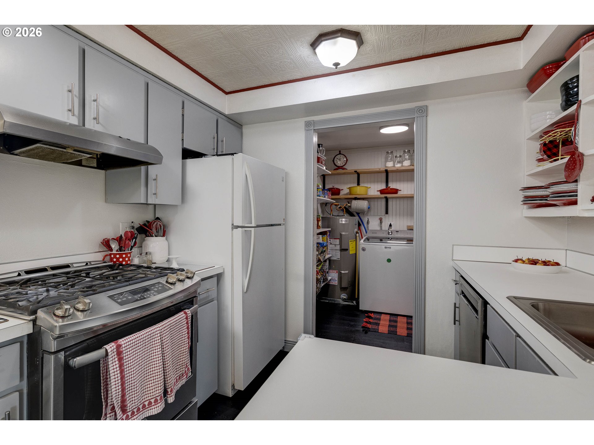 18430 Southwest Broad Oak Boulevard Aloha, OR 97007 - Photo 21 of 32 a kitchen with stainless steel appliances granite countertop a refrigerator and a stove