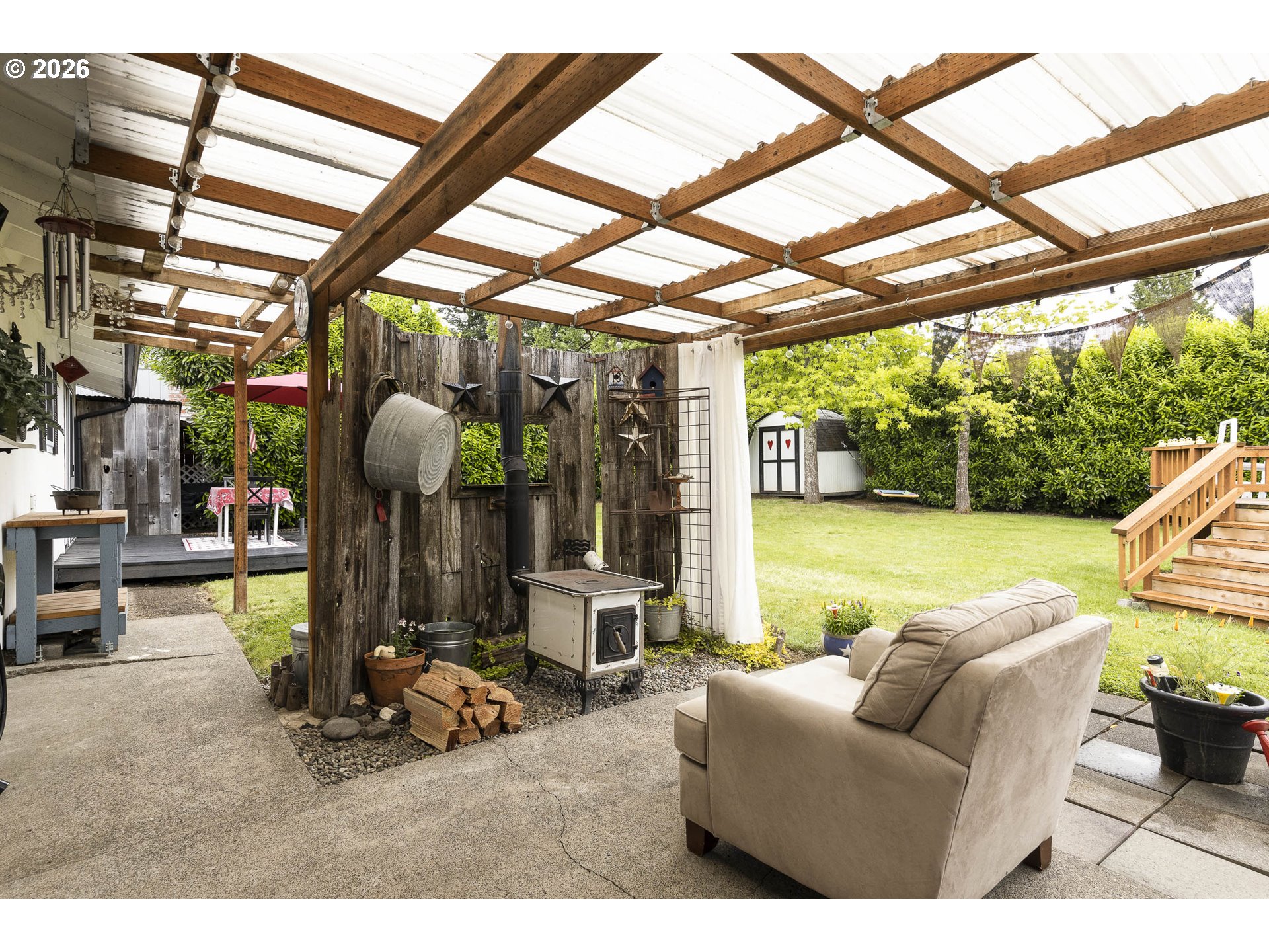 18430 Southwest Broad Oak Boulevard Aloha, OR 97007 - Photo 25 of 32 a living room with furniture and floor to ceiling windows