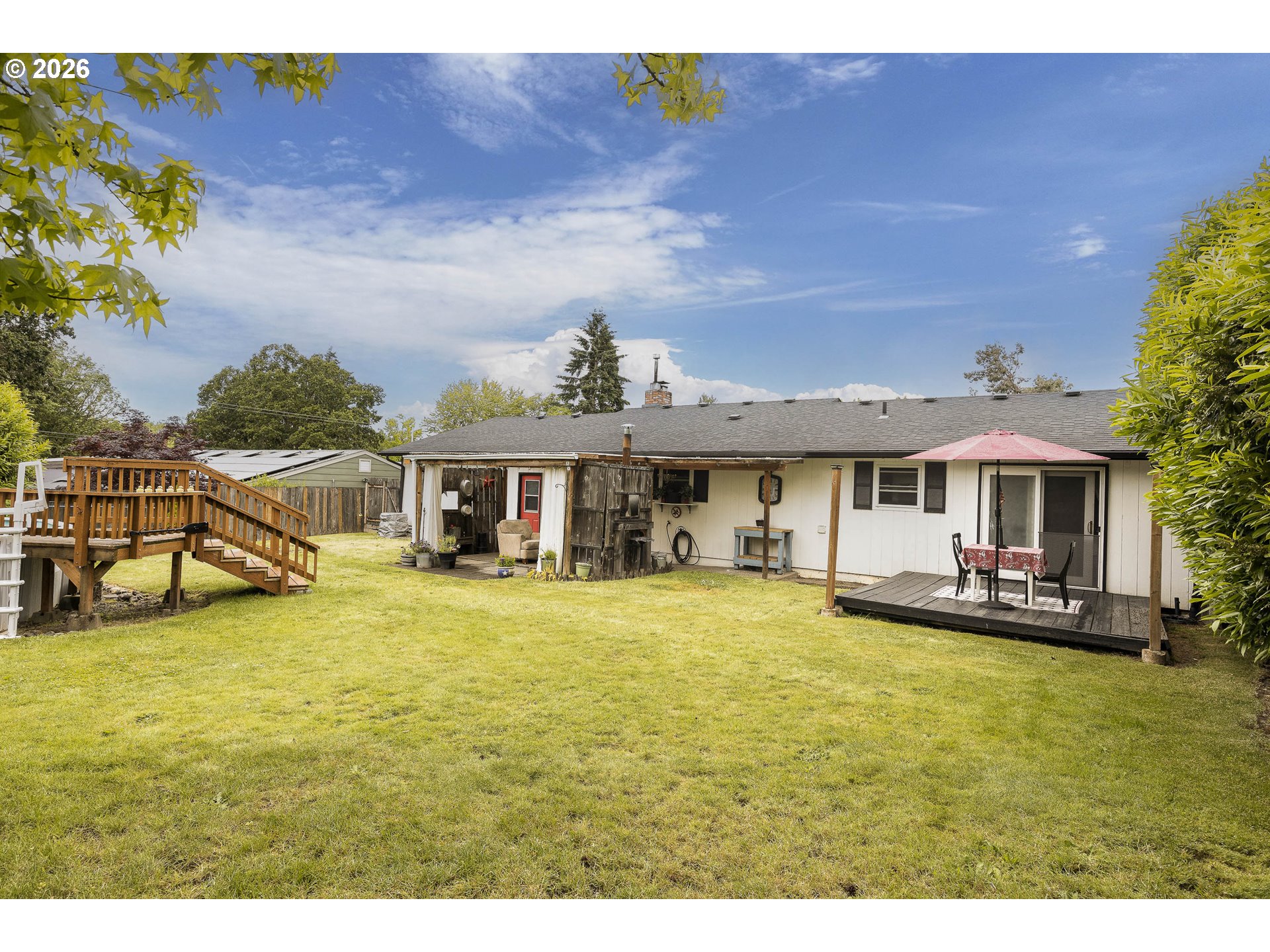 18430 Southwest Broad Oak Boulevard Aloha, OR 97007 - Photo 32 of 32 a view of a house with pool and chairs