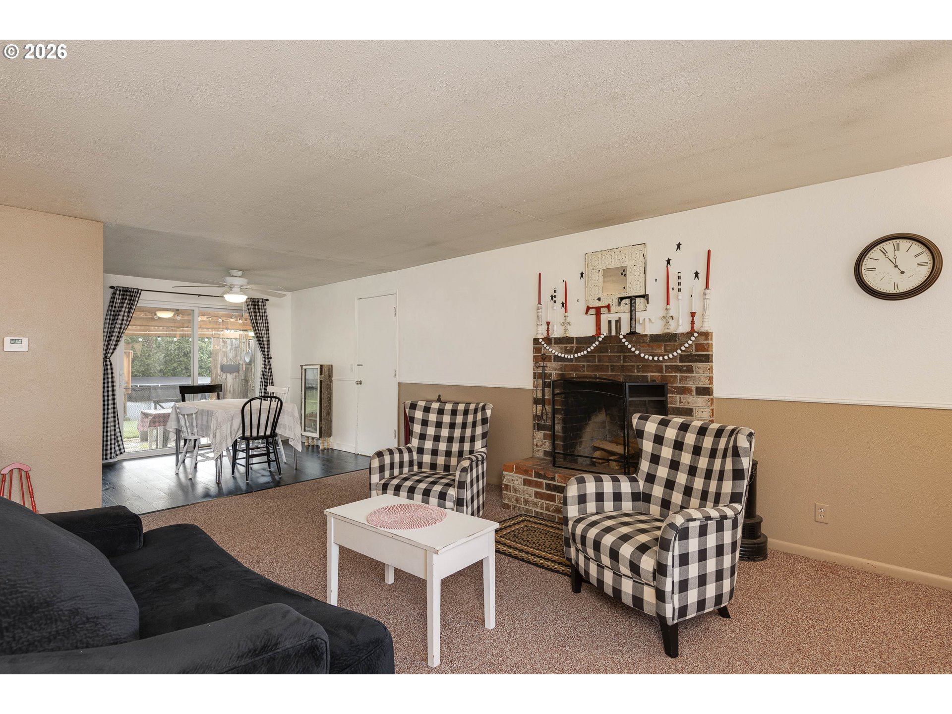 18430 Southwest Broad Oak Boulevard Aloha, OR 97007 - Photo 5 of 32 a view of a livingroom with furniture and a chair