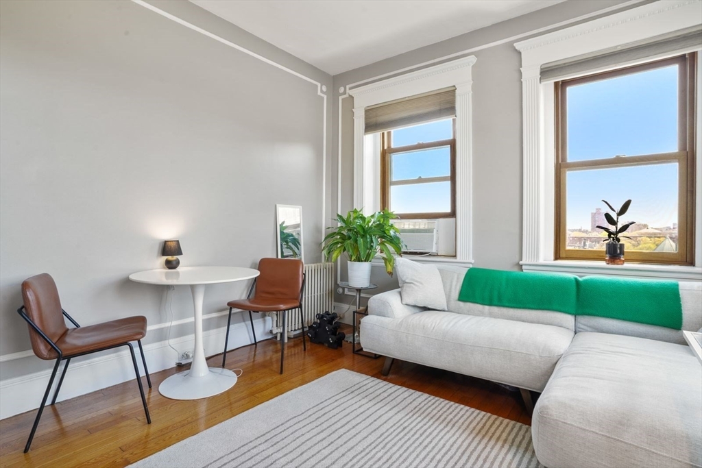8 Garrison Street, Unit 706 Boston, MA 02116 - Photo 2 of 14 a living room with furniture and a window