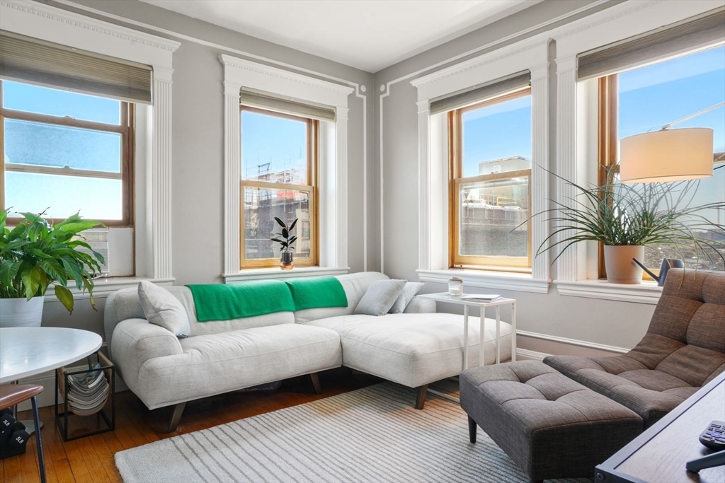 8 Garrison Street, Unit 706 Boston, MA 02116 - Photo 3 of 14 a living room with furniture and a large window