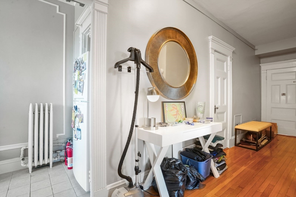 8 Garrison Street, Unit 706 Boston, MA 02116 - Photo 7 of 14 a view of a livingroom with furniture furniture entryway and wooden floor