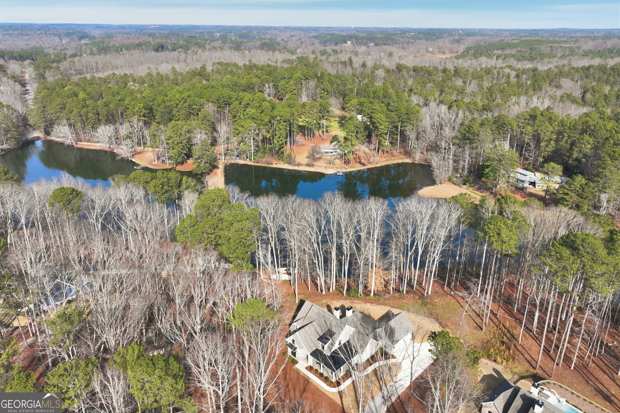1282 Dean Hill Road Southeast Monroe, GA 30655 - Photo 13 of 58 a view of a lake with mountain in the background