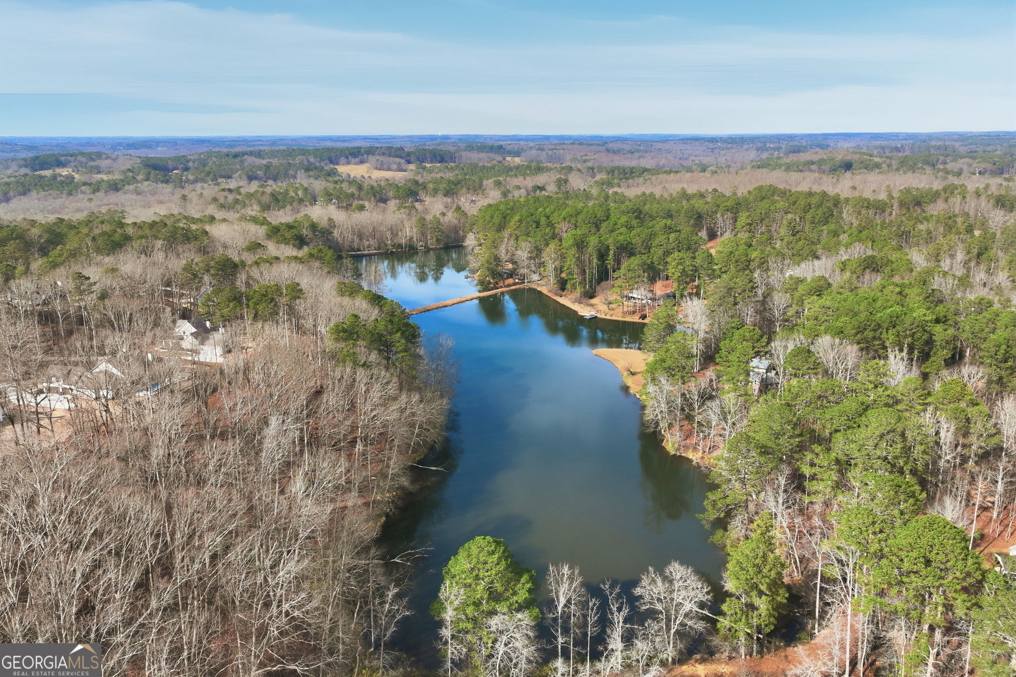 1282 Dean Hill Road Southeast Monroe, GA 30655 - Photo 17 of 58 a view of a lake with a mountain in the background