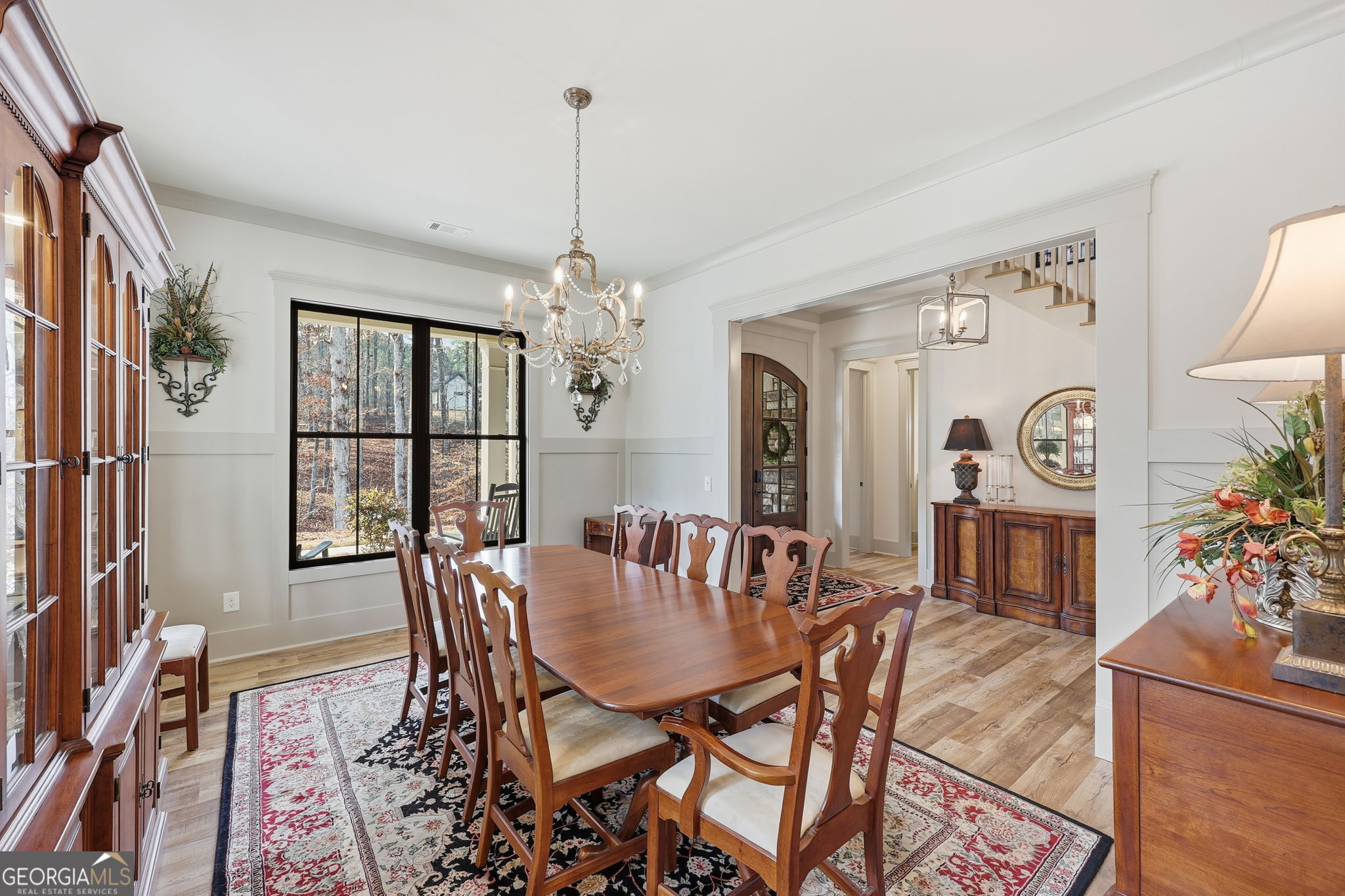 1282 Dean Hill Road Southeast Monroe, GA 30655 - Photo 26 of 58 a view of a dining room with furniture and chandelier