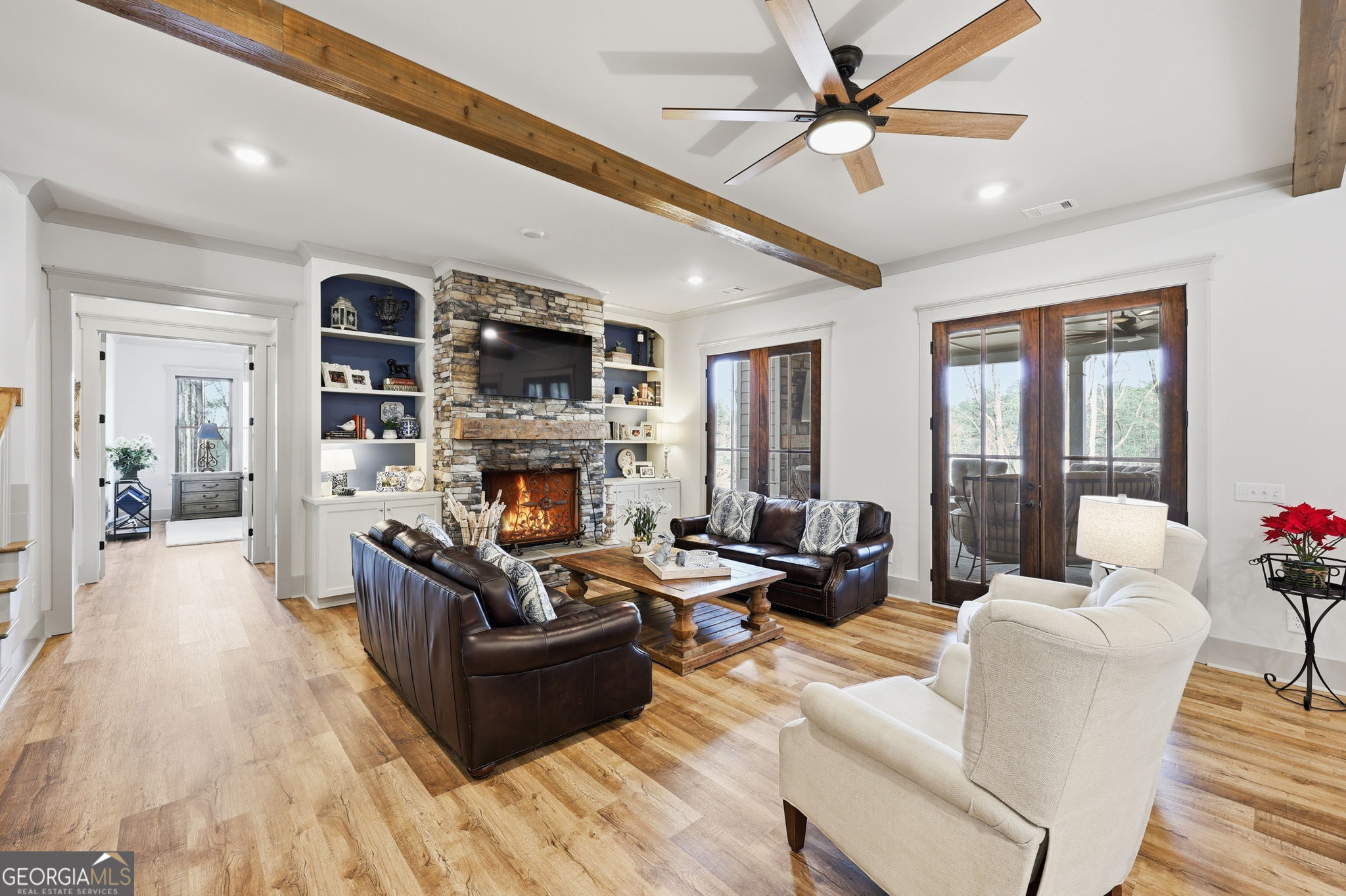 1282 Dean Hill Road Southeast Monroe, GA 30655 - Photo 29 of 58 a living room with furniture flat screen tv and a fireplace