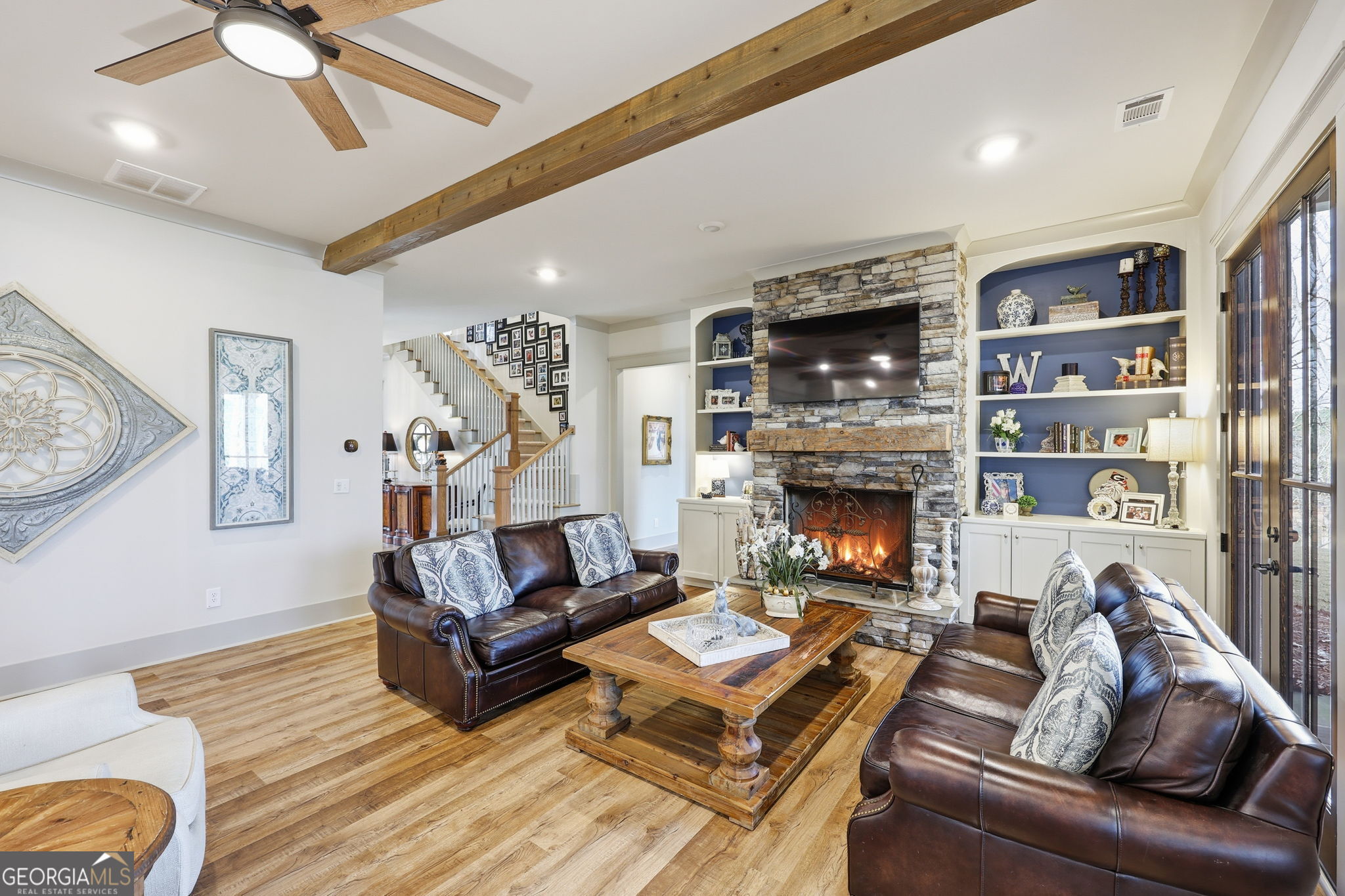 1282 Dean Hill Road Southeast Monroe, GA 30655 - Photo 32 of 58 a living room with furniture and a fireplace