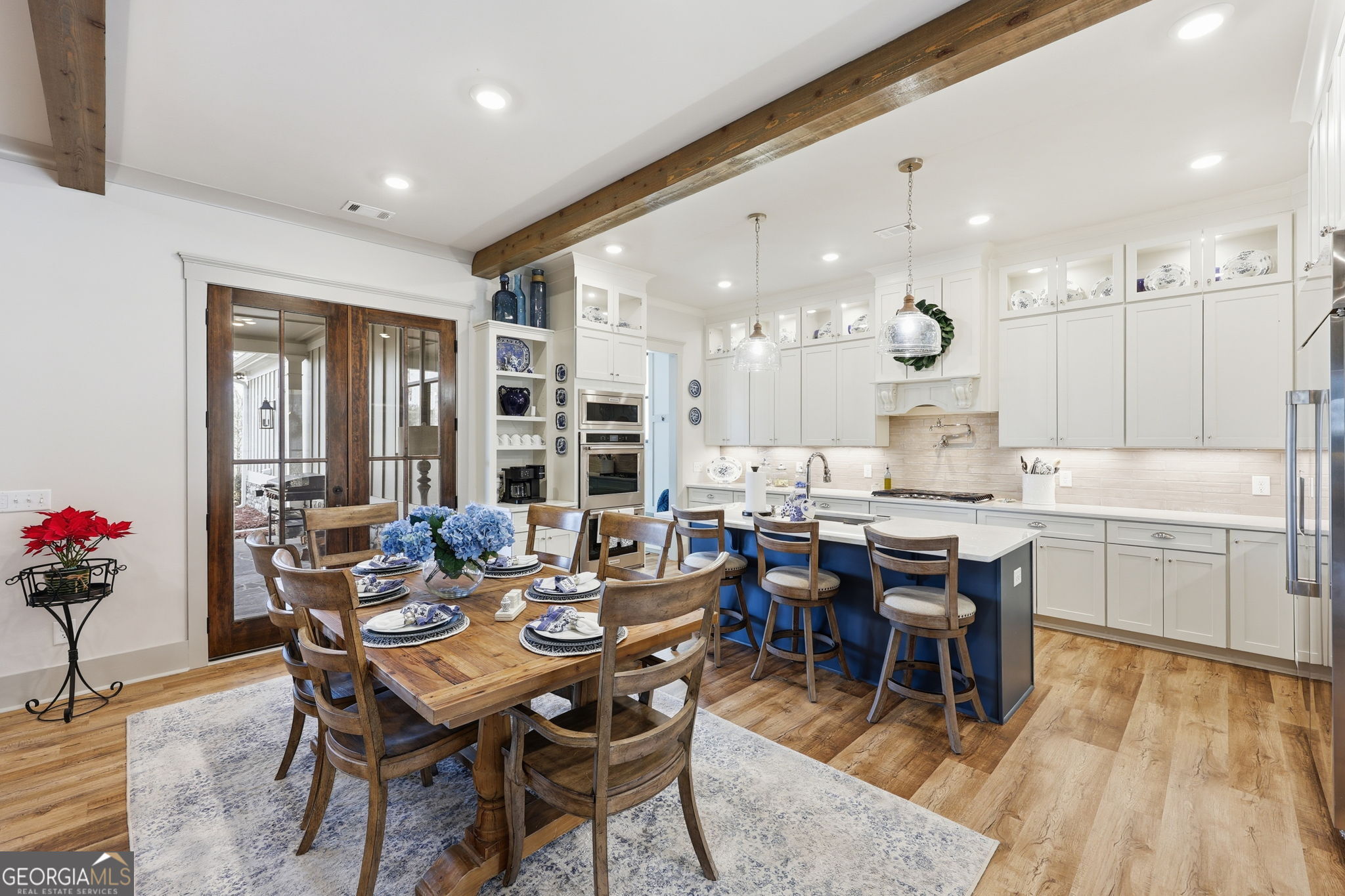 1282 Dean Hill Road Southeast Monroe, GA 30655 - Photo 33 of 58 a dining hall with a dining table and chairs with wooden floor