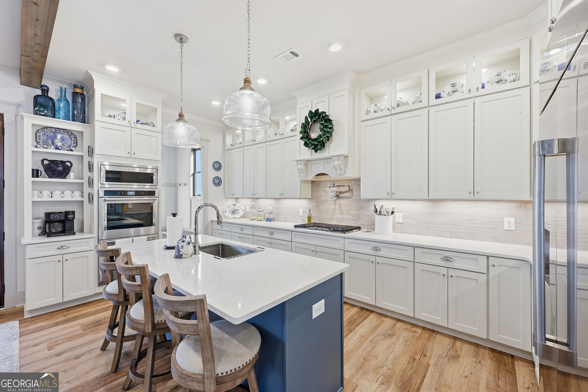 1282 Dean Hill Road Southeast Monroe, GA 30655 - Photo 35 of 58 a kitchen with a sink and cabinets