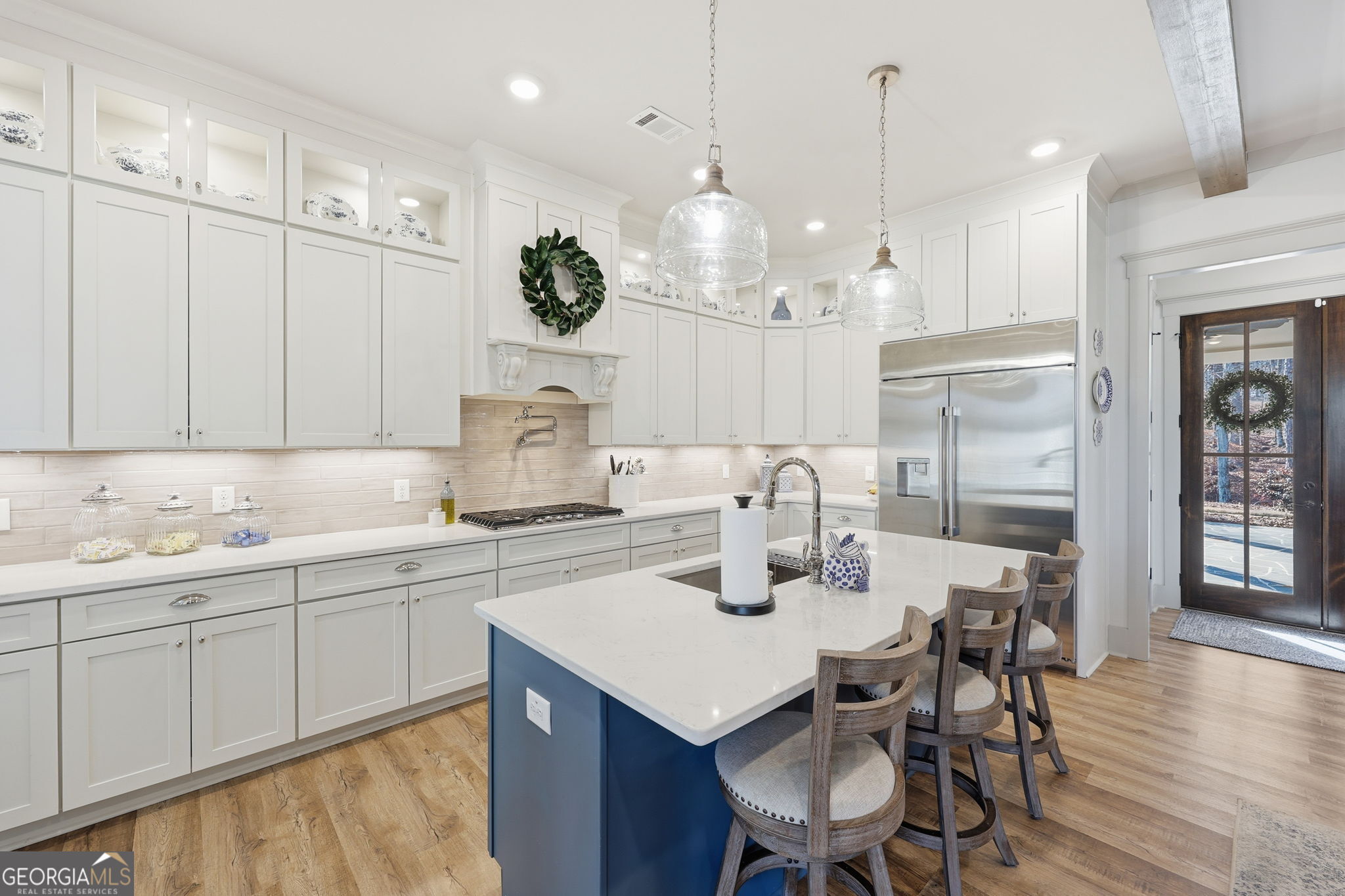1282 Dean Hill Road Southeast Monroe, GA 30655 - Photo 36 of 58 a kitchen with a sink dining table and chairs