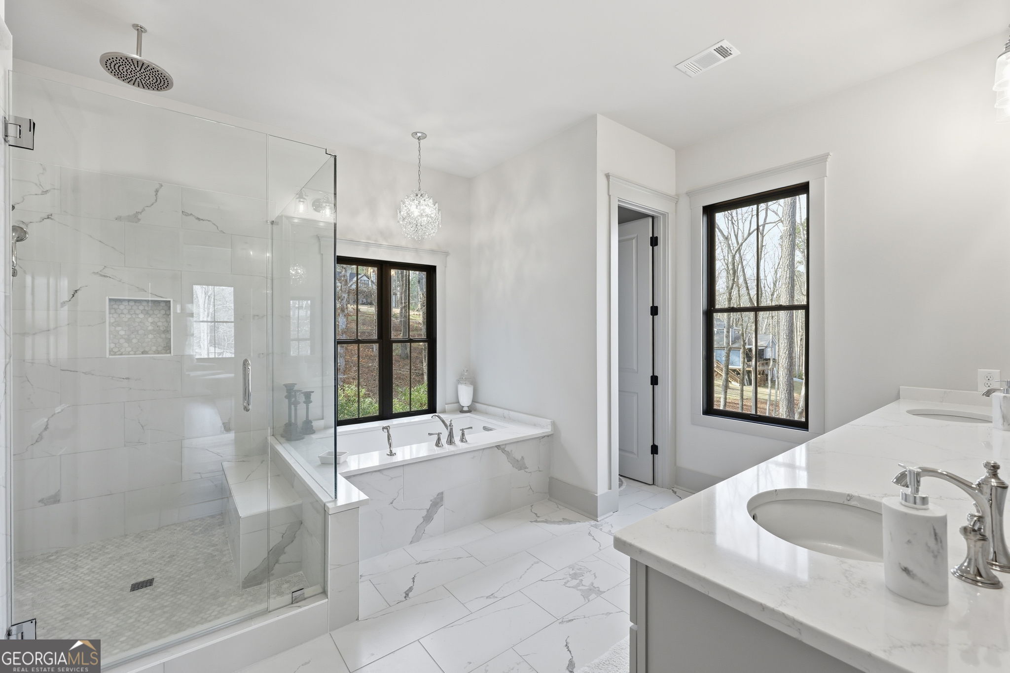 1282 Dean Hill Road Southeast Monroe, GA 30655 - Photo 45 of 58 a spacious bathroom with a tub shower and mirror