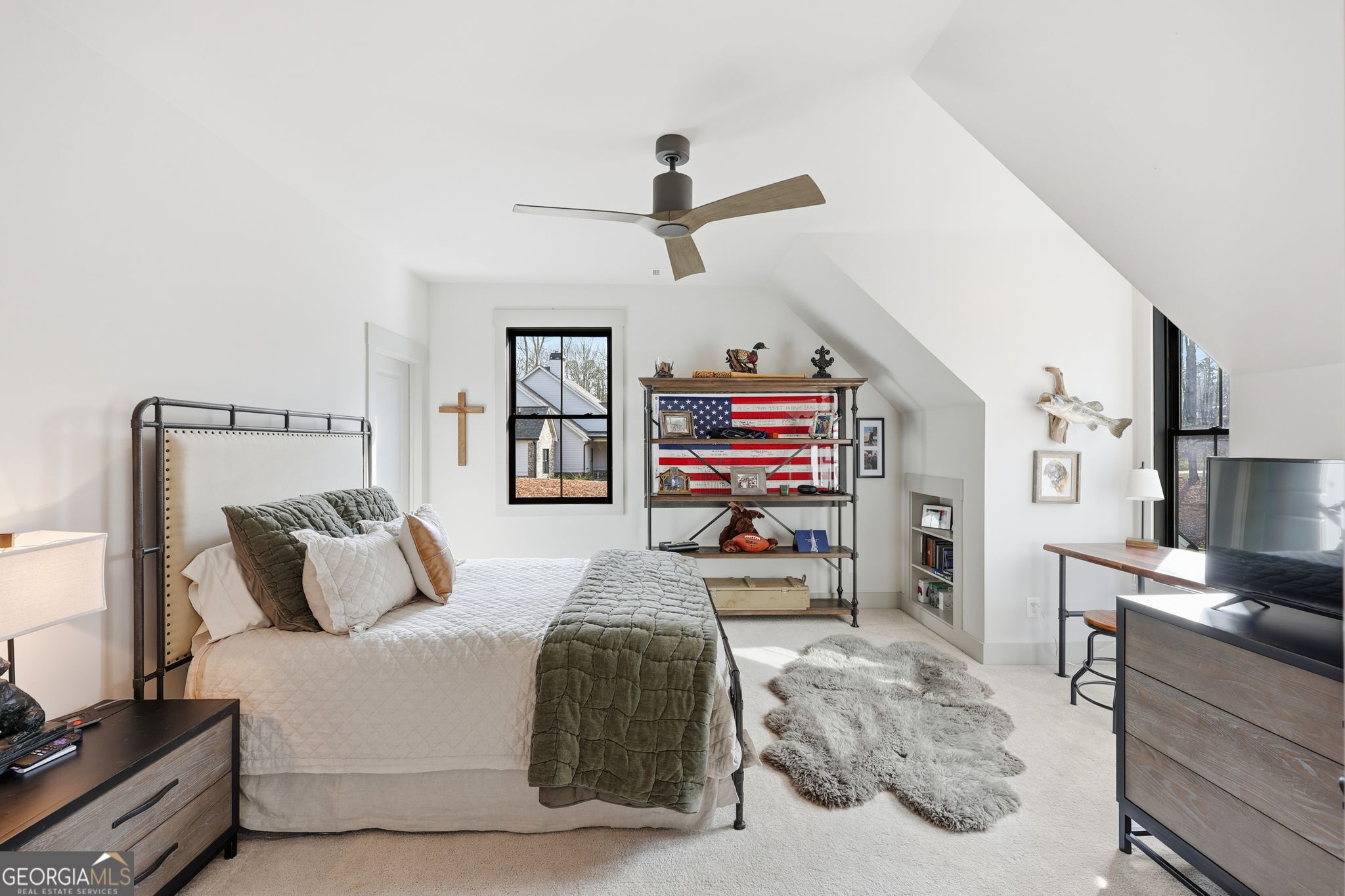 1282 Dean Hill Road Southeast Monroe, GA 30655 - Photo 52 of 58 a bedroom with furniture and a chandelier