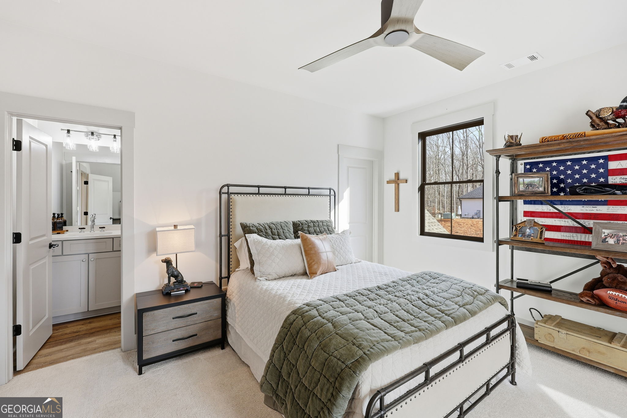 1282 Dean Hill Road Southeast Monroe, GA 30655 - Photo 53 of 58 a bedroom with a bed and a dresser