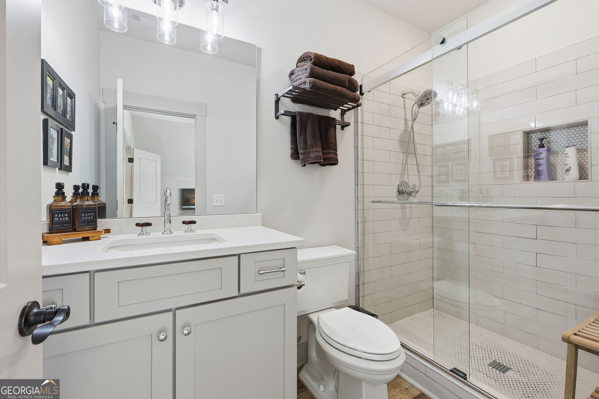 1282 Dean Hill Road Southeast Monroe, GA 30655 - Photo 54 of 58 a bathroom with a sink toilet and shower