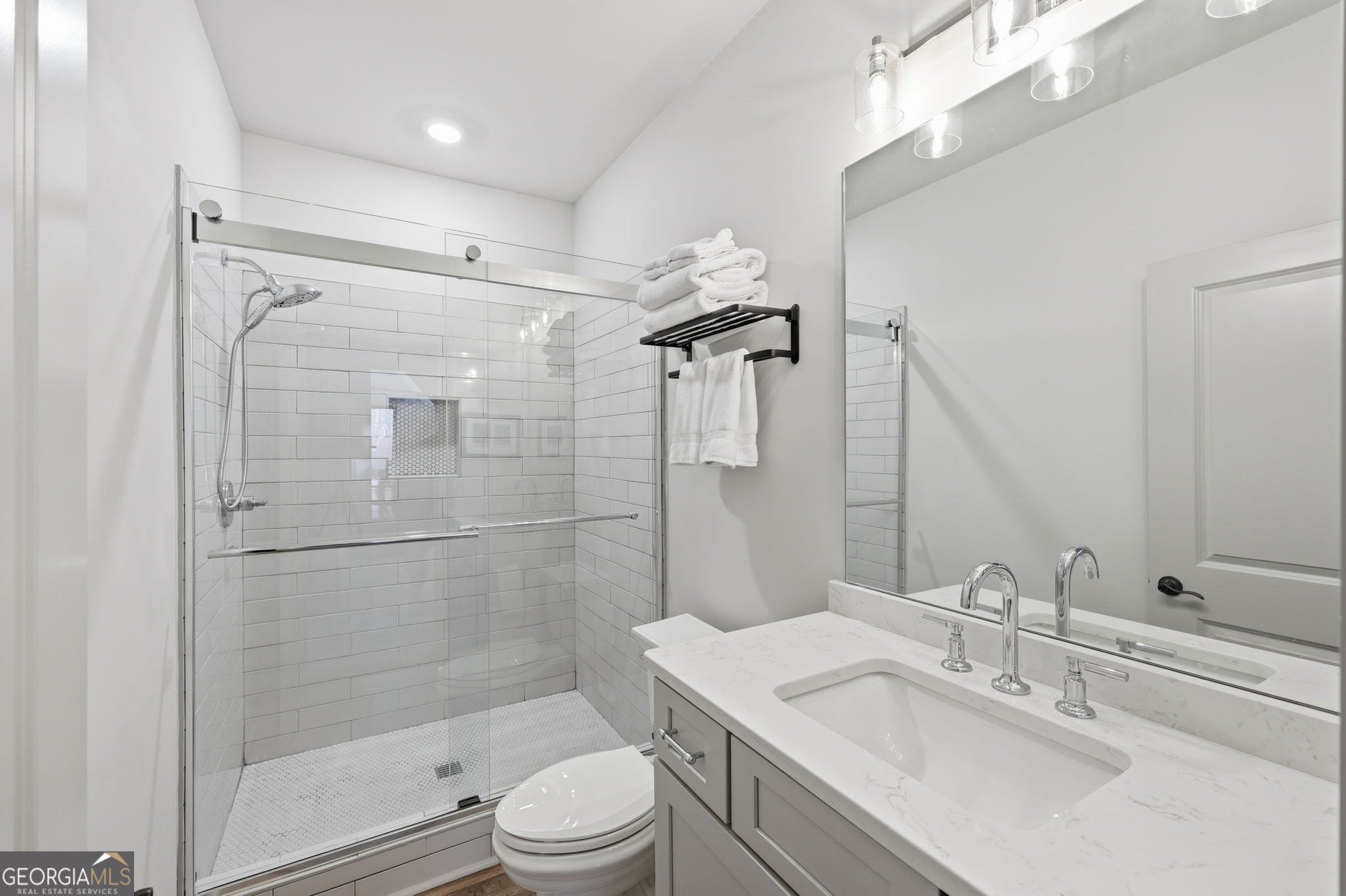 1282 Dean Hill Road Southeast Monroe, GA 30655 - Photo 57 of 58 a bathroom with a sink toilet and shower