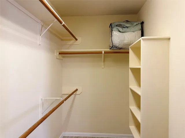 a view of storage and utility room with racks on the wall
