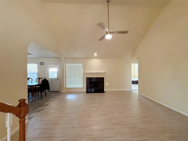 a view of a livingroom with furniture fireplace and wooden floor