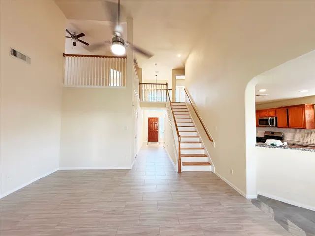 a view of a living room with wooden floor