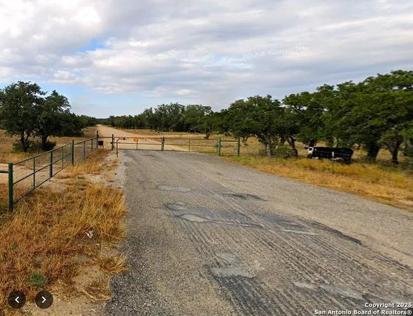 a view of a lake with houses in the back