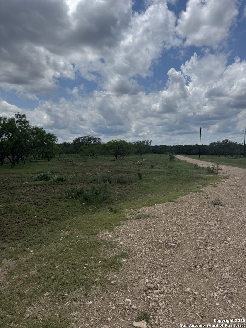 324 Quail Trail Menard, TX 76859 - Photo 4 of 7 a view of a big yard with a fountain