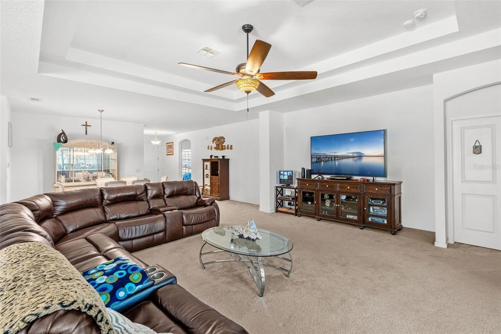 2085 Lula Road Minneola, FL 34715 - Photo 27 of 39 a living room with furniture and a flat screen tv