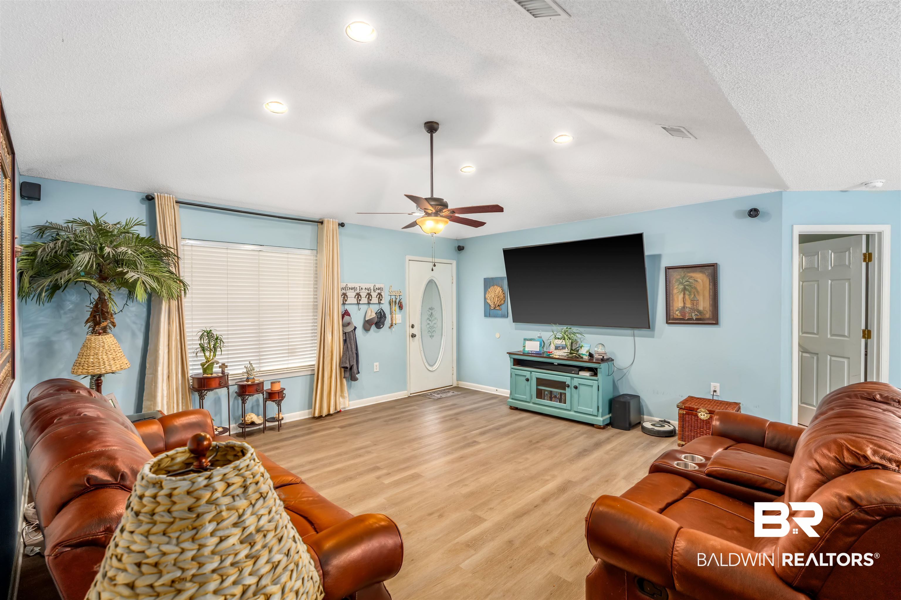 23186 Pecan Street Robertsdale, AL 36567 - Photo 8 of 36 Living room featuring light wood-type flooring, a textured ceiling, and ceiling fan